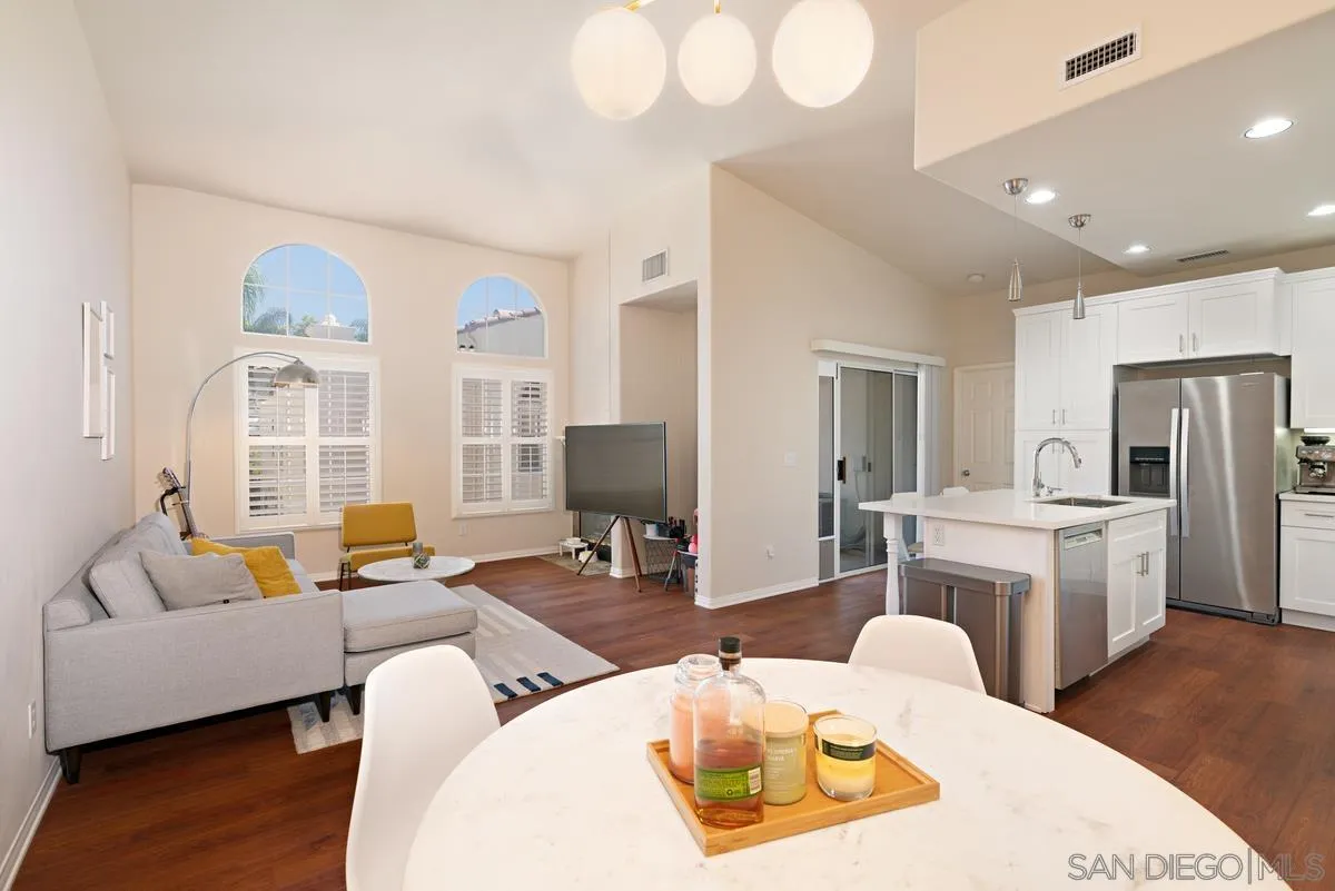 11456 Miro Circle San Diego, CA 92131 - Photo 8 of 34 a living room with furniture a large window and wooden floor