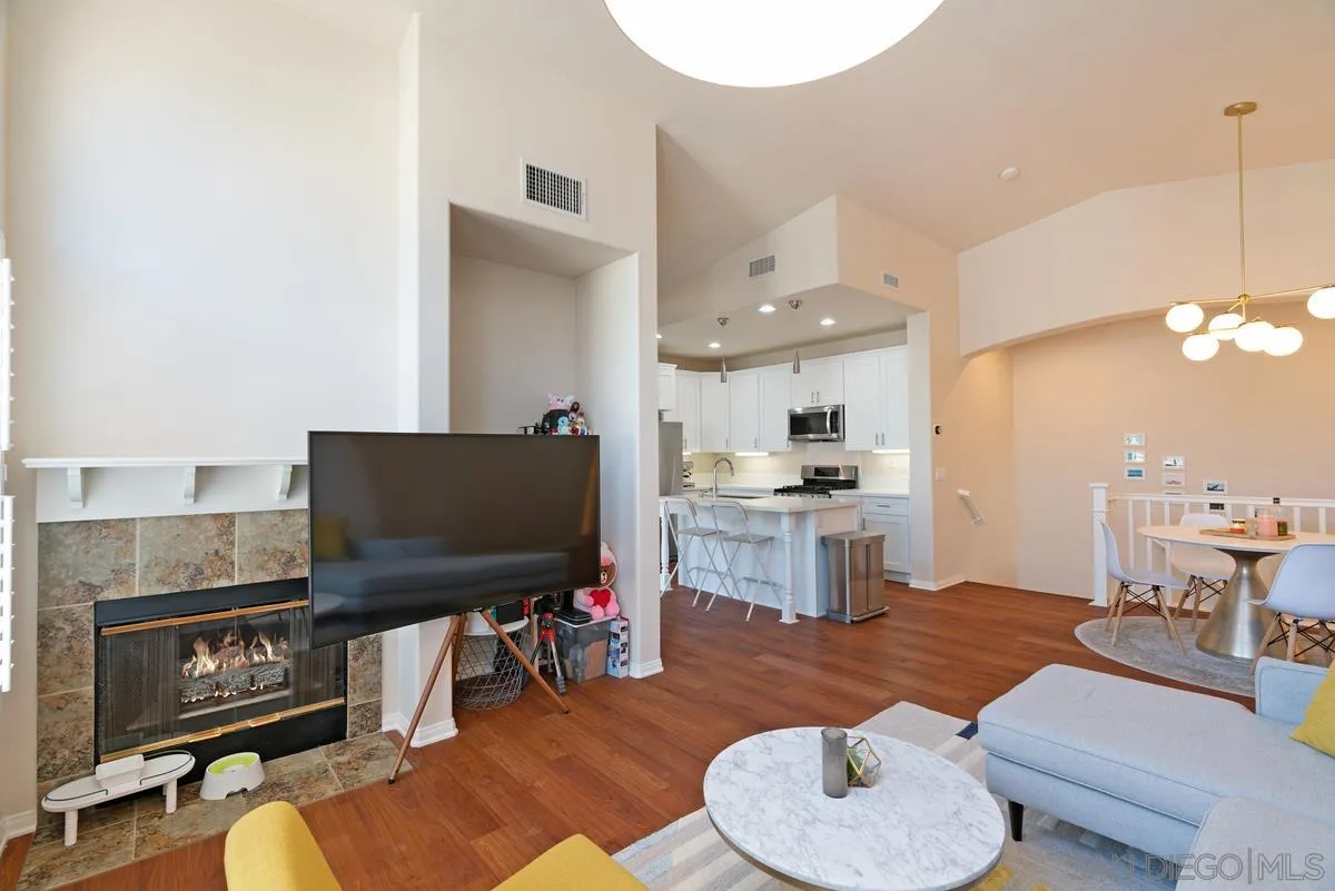 11456 Miro Circle San Diego, CA 92131 - Photo 10 of 34 a living room with furniture and a flat screen tv