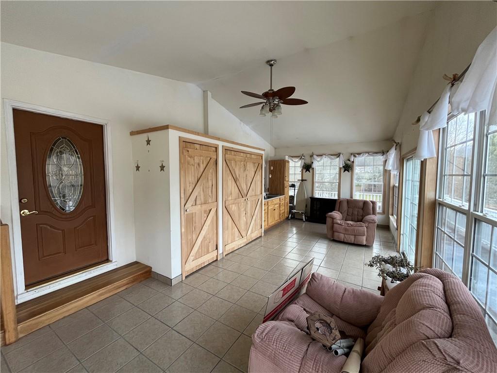 83 Seger Road Punxsutawney, PA 15767 - Photo 15 of 24 a living room with furniture a ceiling fan and a window