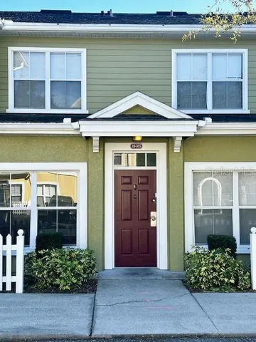 a front view of a house with a garden and entryway