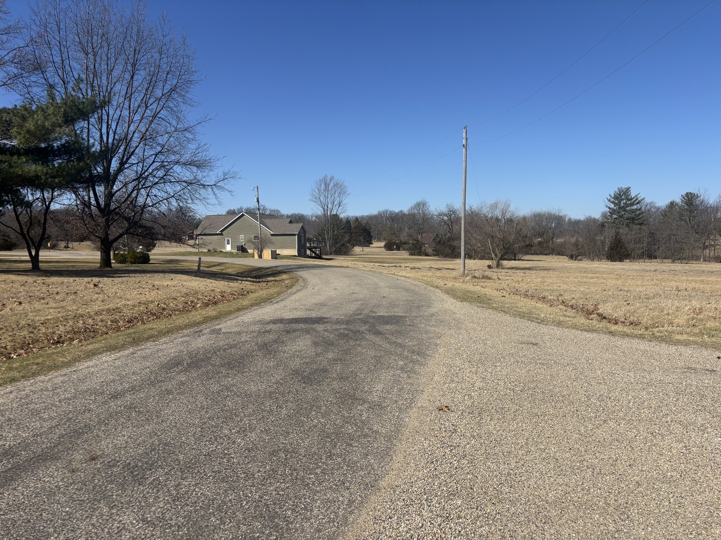 1043 Hidden Valley Drive Varna, IL 61375 - Photo 8 of 9 a view of a road with a yard