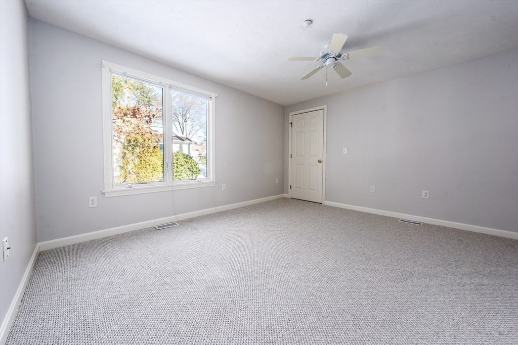 13 Pga Lane, Unit 424 Mashpee, MA 02649 - Photo 12 of 19 an empty room with windows and closet