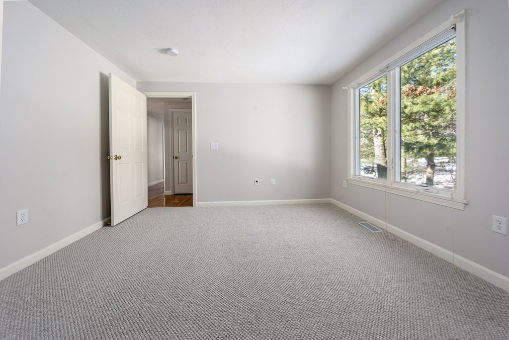 13 Pga Lane, Unit 424 Mashpee, MA 02649 - Photo 13 of 19 an empty room with windows and closet