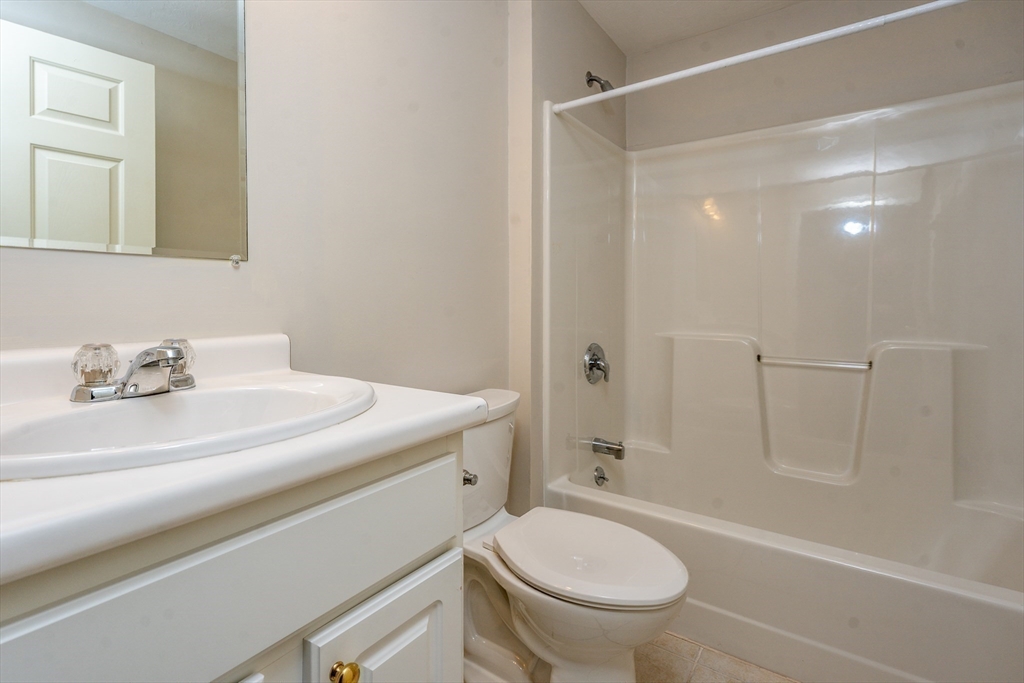 13 Pga Lane, Unit 424 Mashpee, MA 02649 - Photo 14 of 19 a bathroom with a sink a toilet and shower