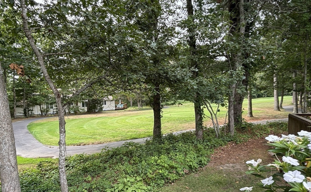 13 Pga Lane, Unit 424 Mashpee, MA 02649 - Photo 15 of 19 a view of a yard with swimming pool