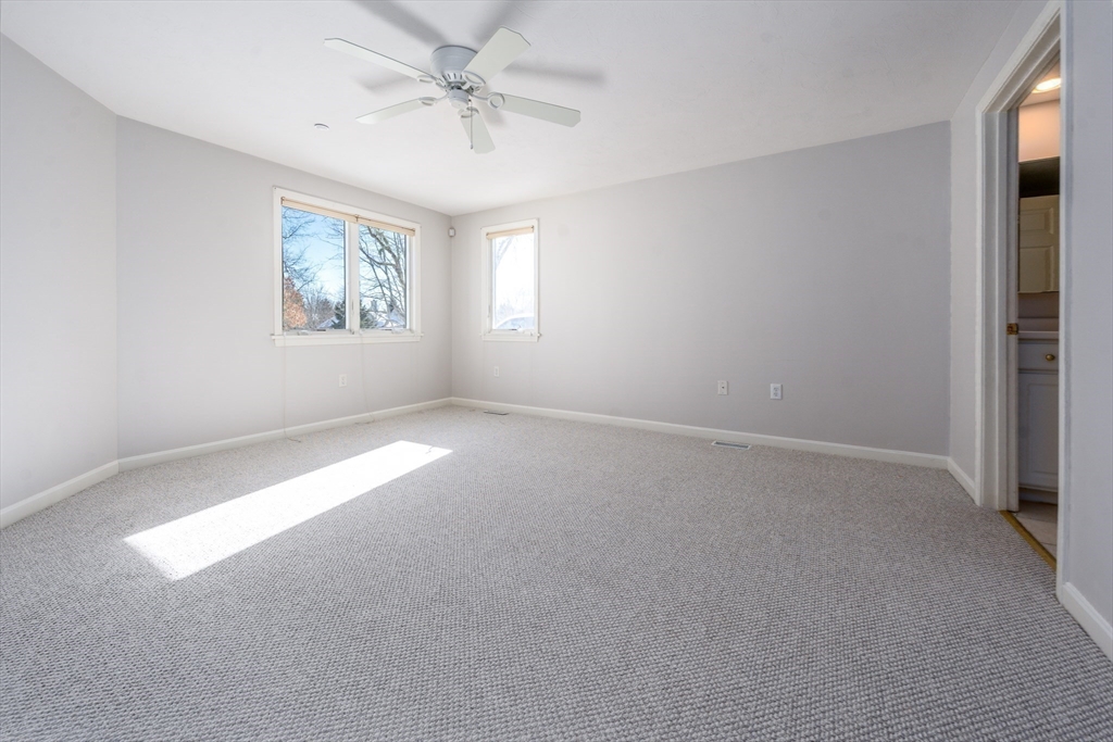 13 Pga Lane, Unit 424 Mashpee, MA 02649 - Photo 9 of 19 a view of a big room with windows and chandelier fan