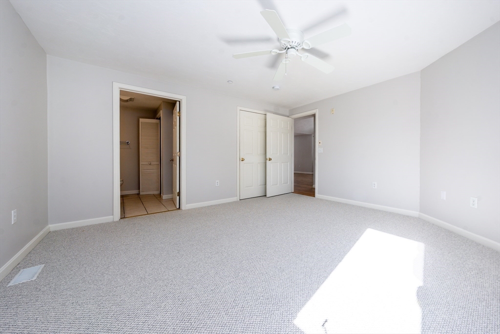 13 Pga Lane, Unit 424 Mashpee, MA 02649 - Photo 10 of 19 a view of an empty room with a window