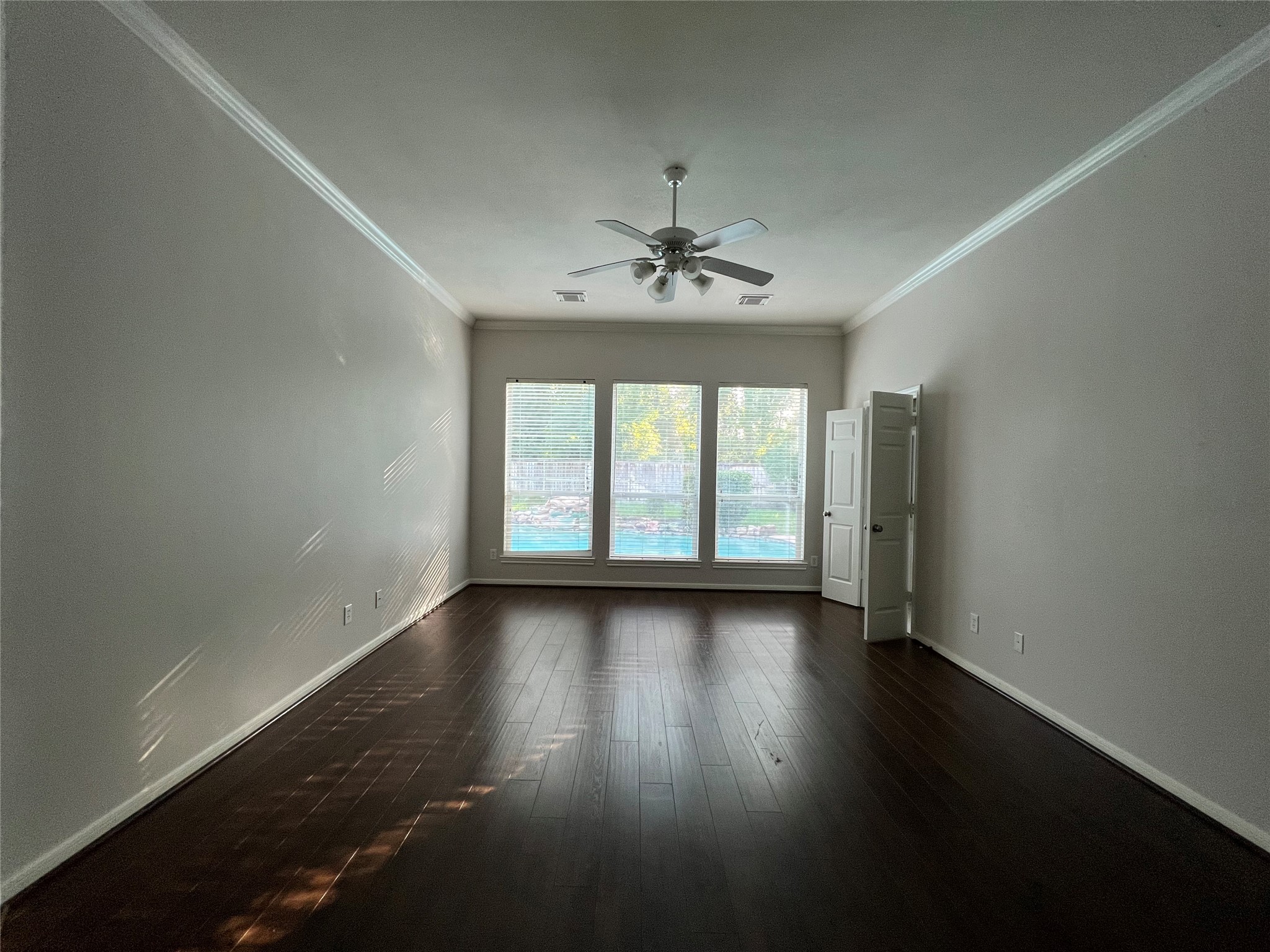 23703 Banning Point Court Katy, TX 77494 - Photo 14 of 30 an empty room with wooden floor and windows