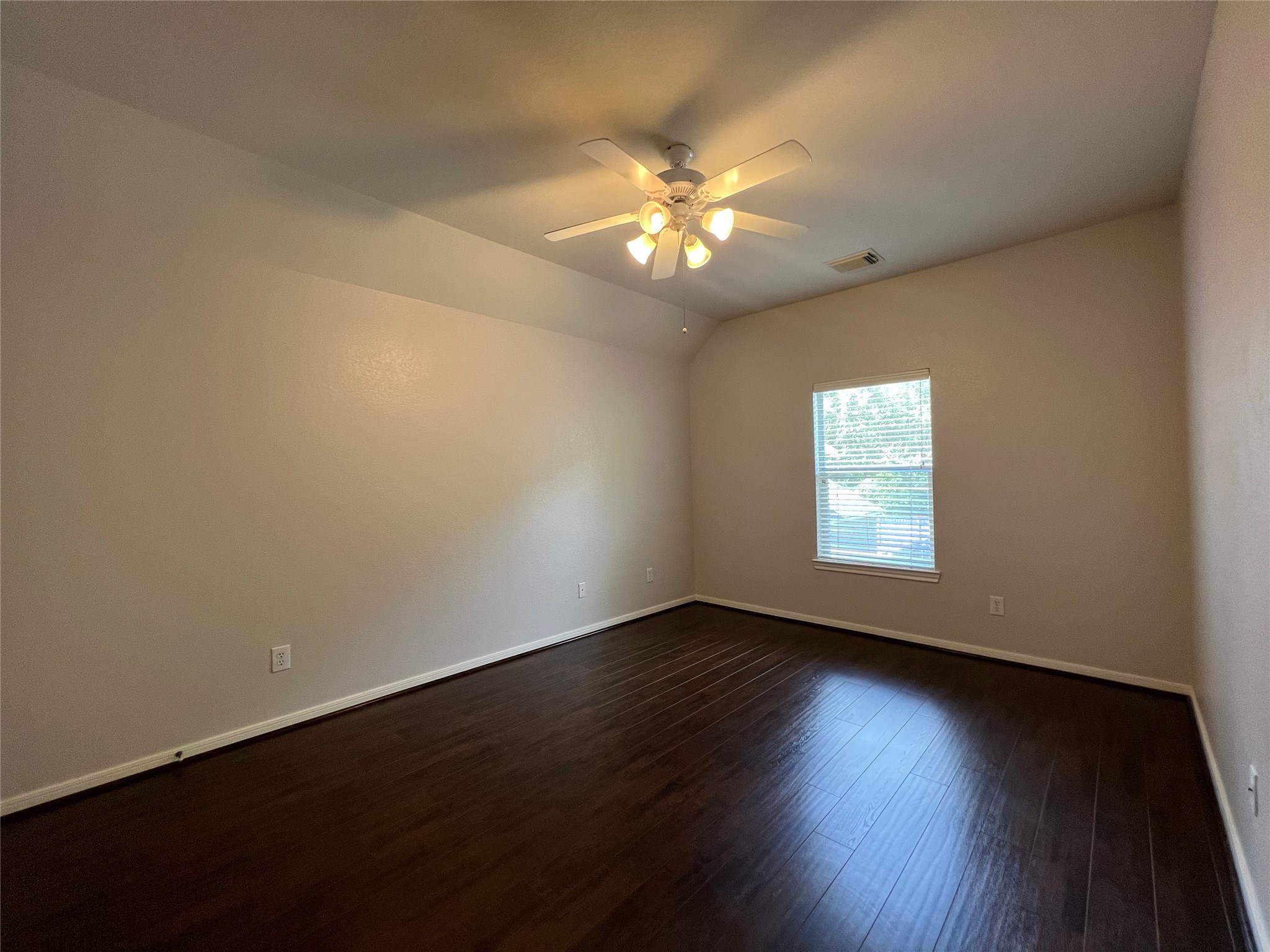 23703 Banning Point Court Katy, TX 77494 - Photo 26 of 30 a view of an empty room with wooden floor and a window