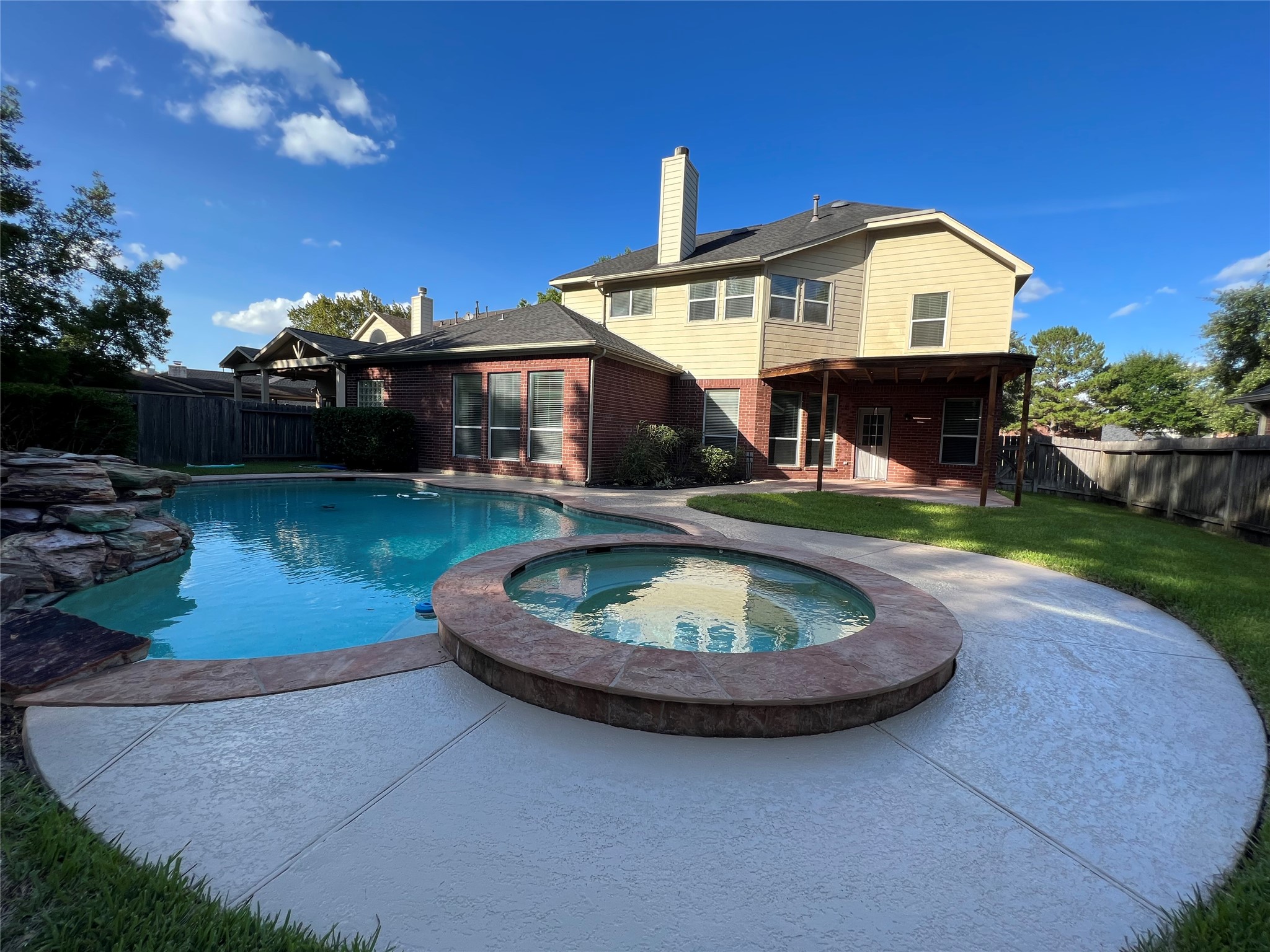 23703 Banning Point Court Katy, TX 77494 - Photo 29 of 30 a front view of a house with a yard and potted plants