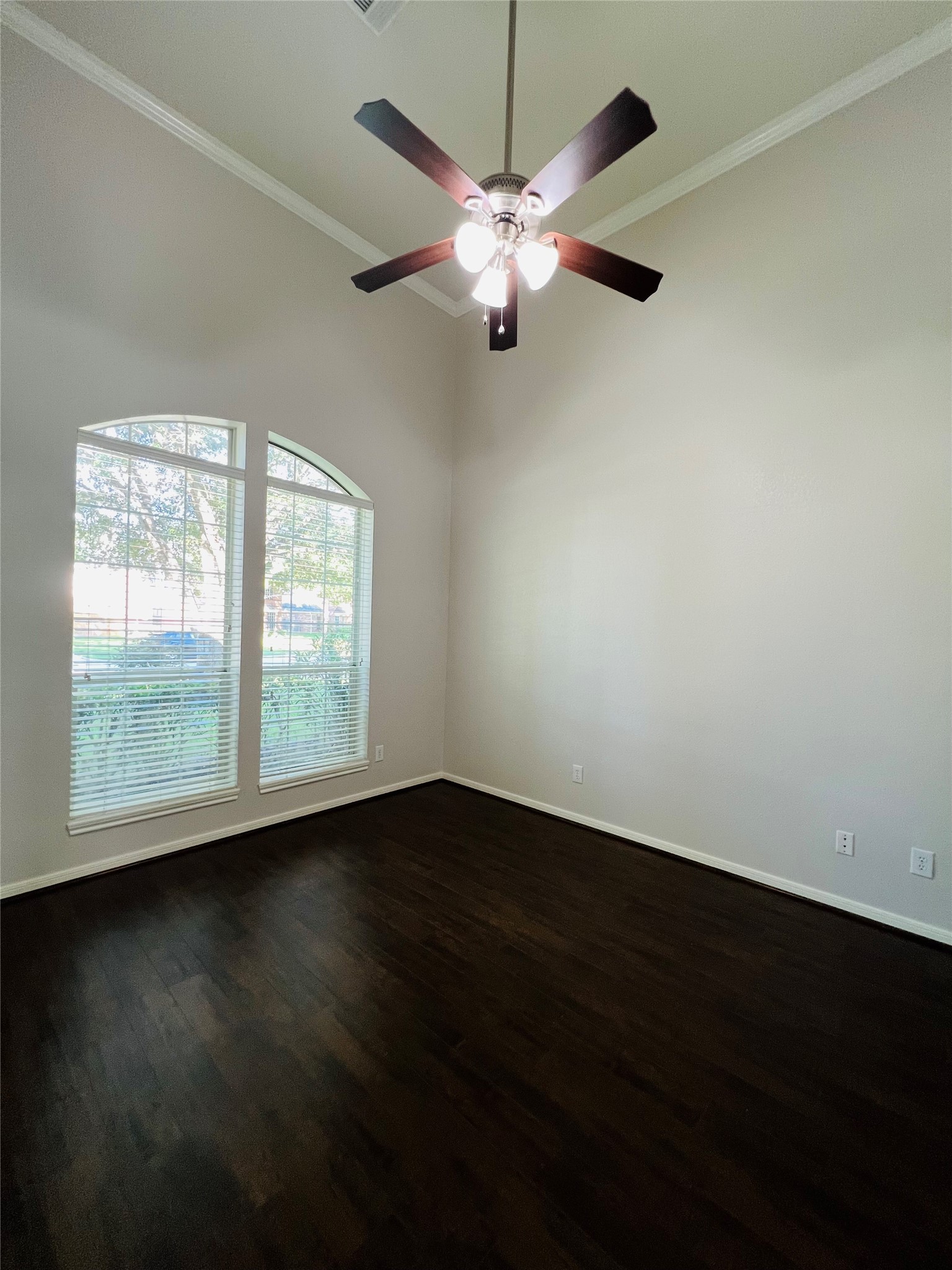23703 Banning Point Court Katy, TX 77494 - Photo 4 of 30 a view of an empty room with wooden floor and a window