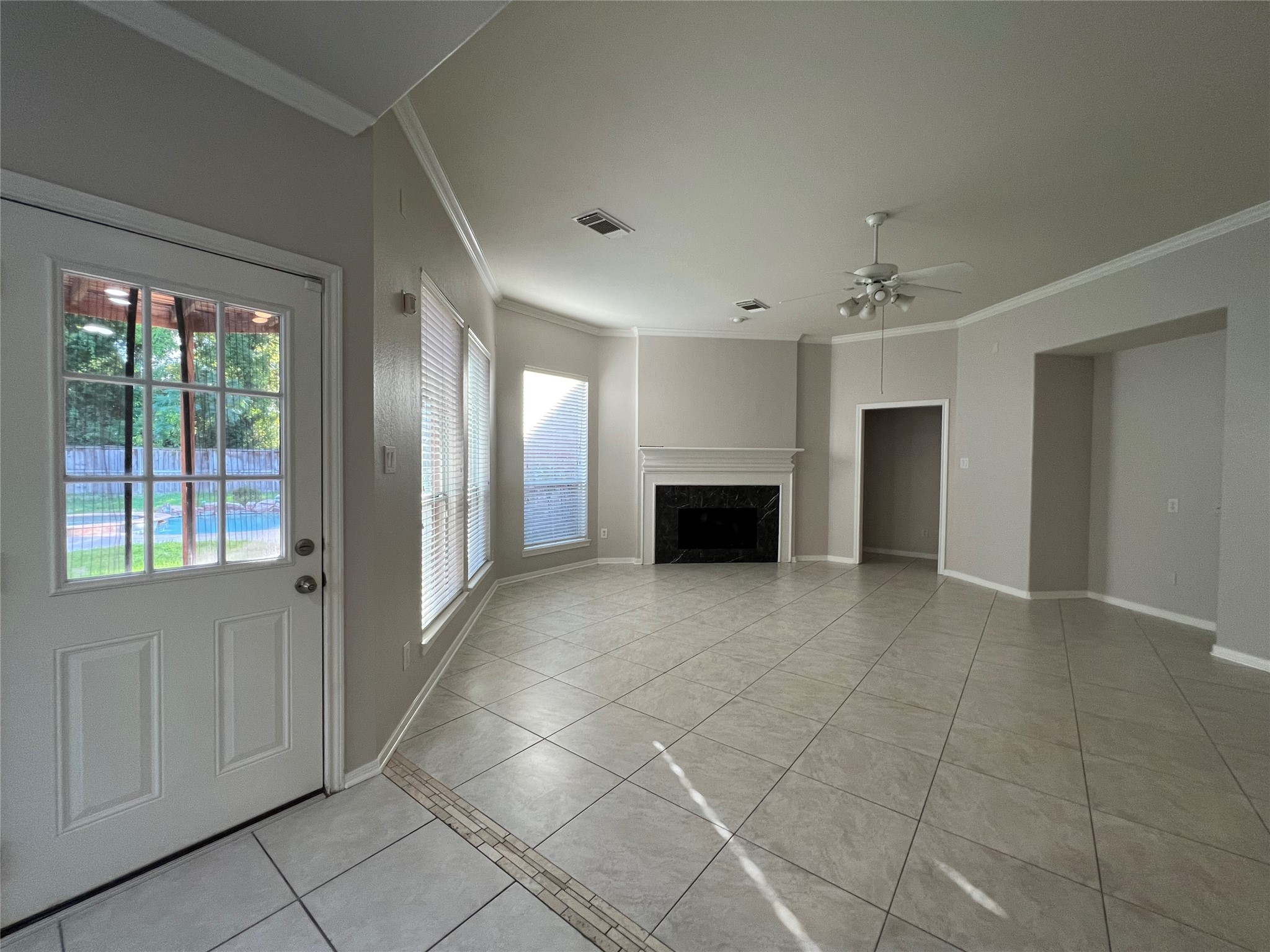 23703 Banning Point Court Katy, TX 77494 - Photo 6 of 30 a view of an empty room with a fireplace and a window