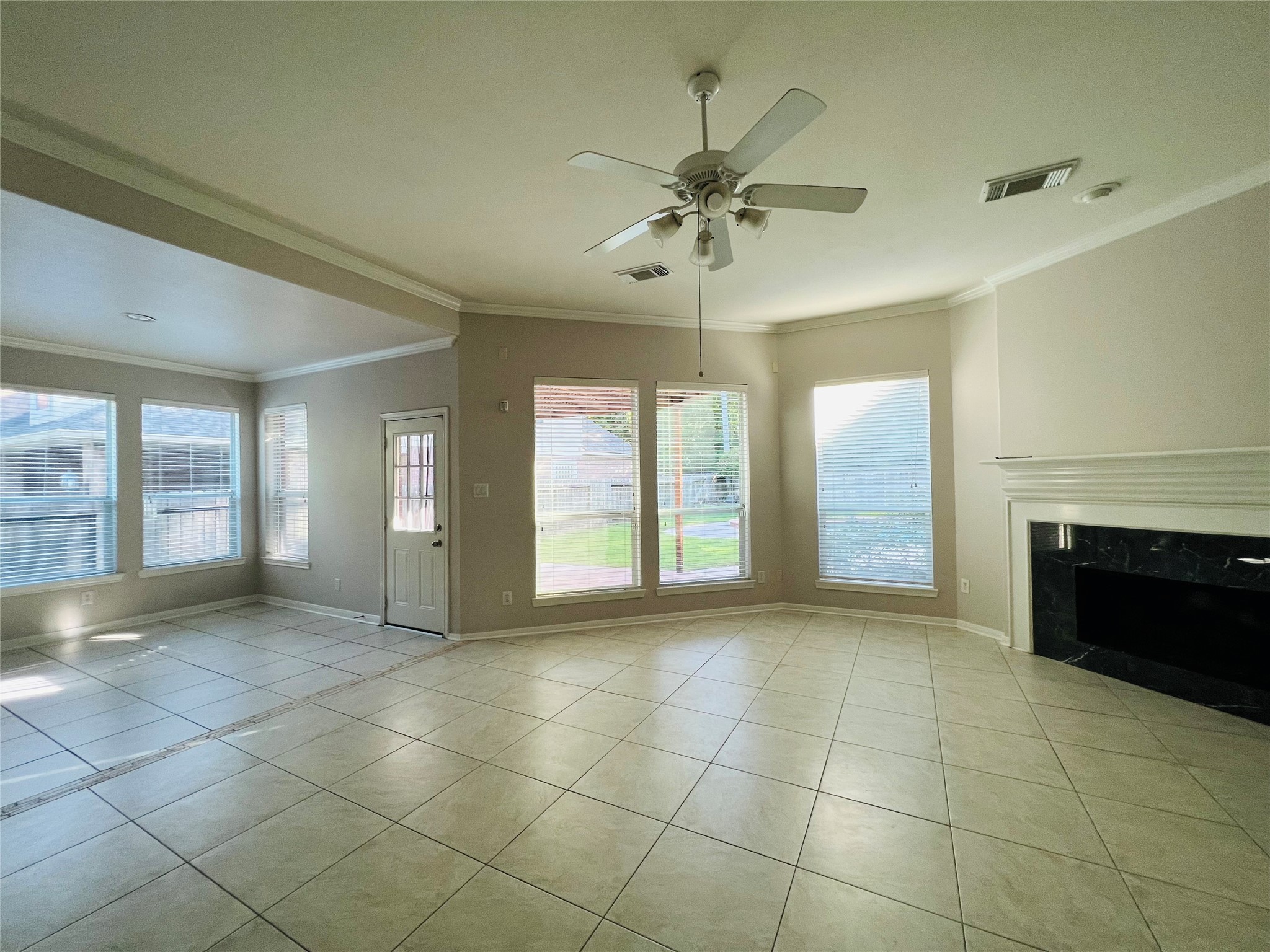 23703 Banning Point Court Katy, TX 77494 - Photo 8 of 30 a view of an empty room with a fireplace and a window
