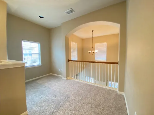 a view of hallway with windows