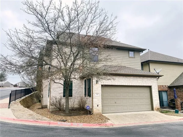 a front view of a house with garage