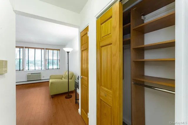 a view of a hallway with closet
