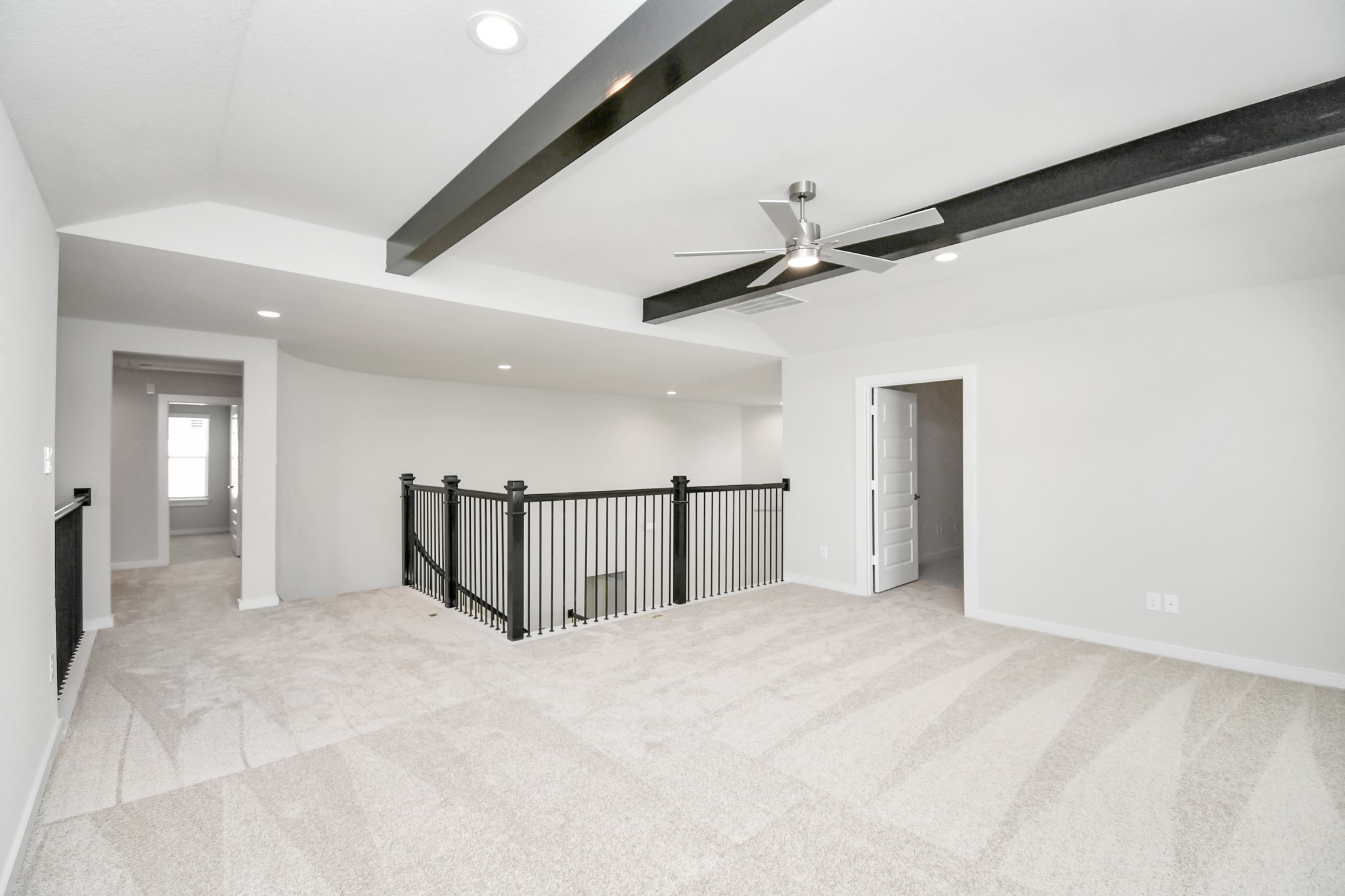 3038 Native Spg Drive Spring, TX 77373 - Photo 28 of 40 Ascend to relaxation in this fantastic game room! Ideal for both casual gatherings and adult gaming, it boasts plush carpet, lofty ceilings, custom paint, and ample windows for abundant natural light. Sample photo of completed home with similar floor plan. Actual colors and selections may vary.