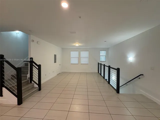 a view of a hallway with windows