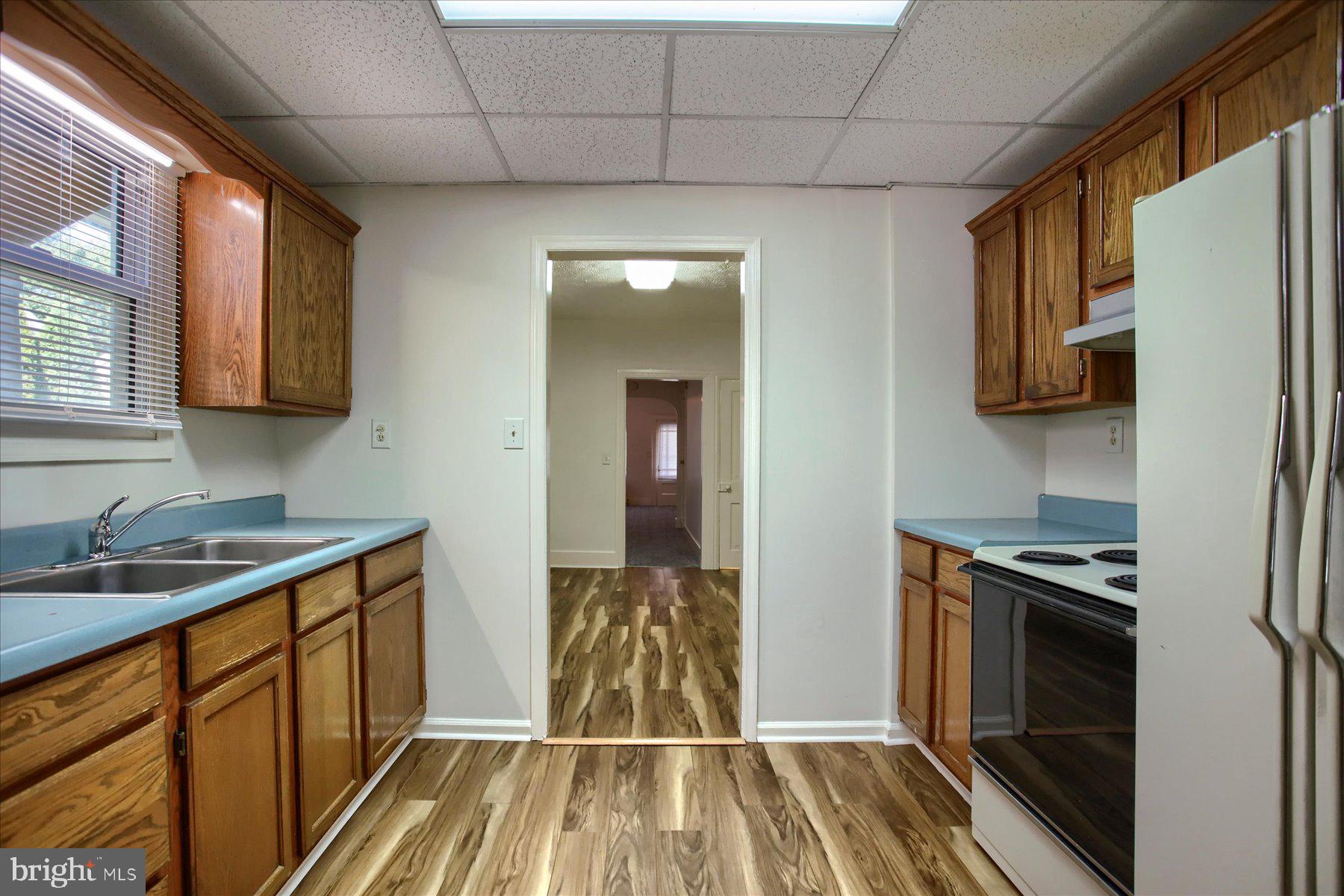 424 West Main Street Palmyra, PA 17078 - Photo 11 of 17 a kitchen with stainless steel appliances granite countertop a sink stove and refrigerator