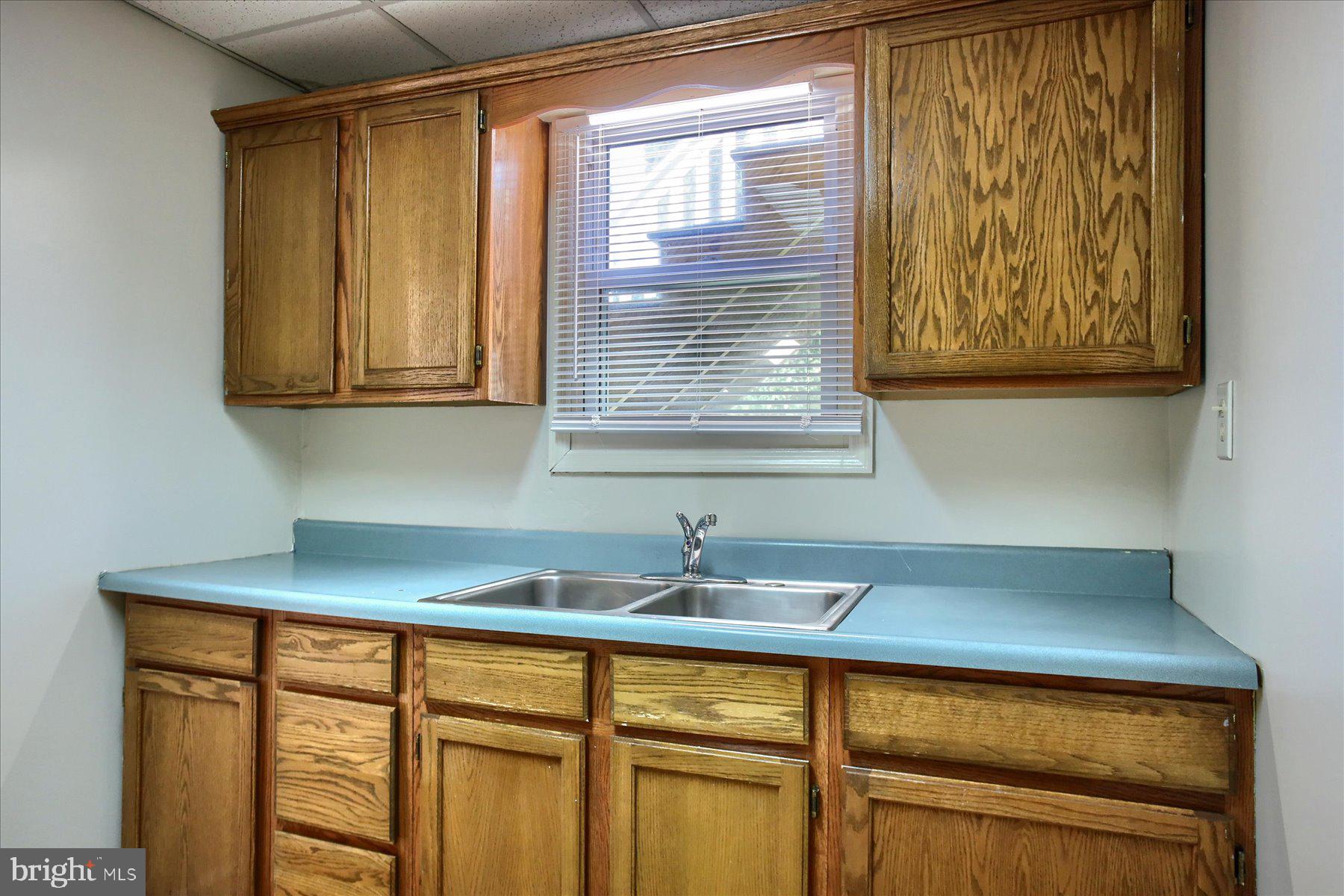 424 West Main Street Palmyra, PA 17078 - Photo 10 of 17 a kitchen with a sink a window and cabinets