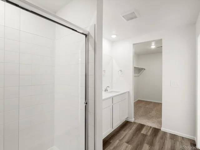 a bathroom with a sink double vanity and a mirror