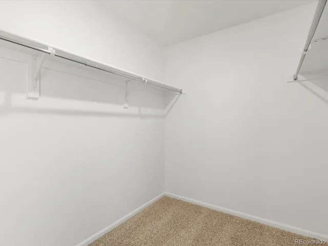 a view of storage and utility room with washer and dryer