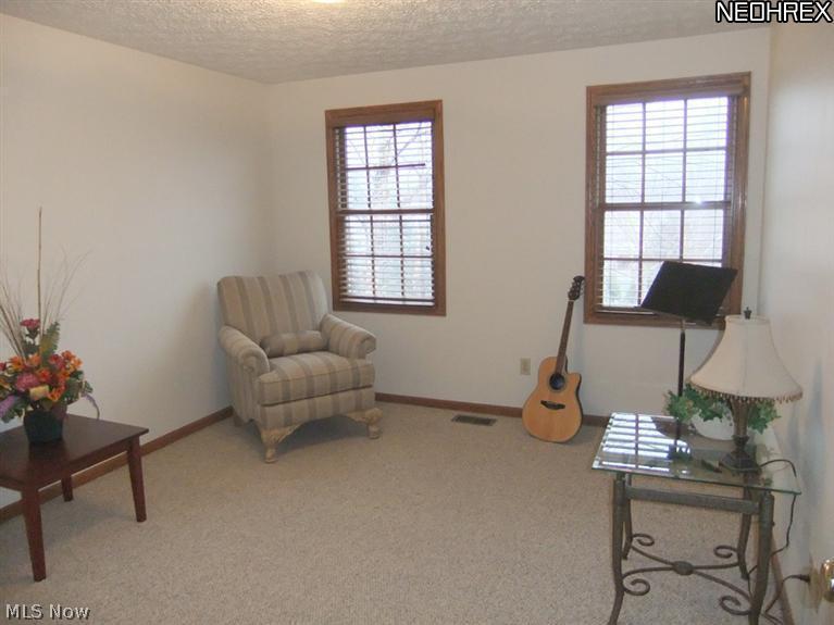 3795 Stonebridge Boulevard Akron, OH 44321 - Photo 21 of 24 The fourth bedroom also features neutral carpet and a double closet.
