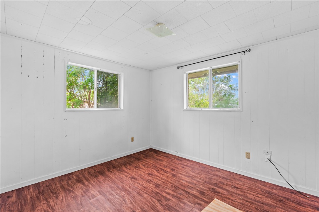 1011 Northcliff Drive Portland, TX 78374 - Photo 12 of 16 a view of room with hardwood floor and window