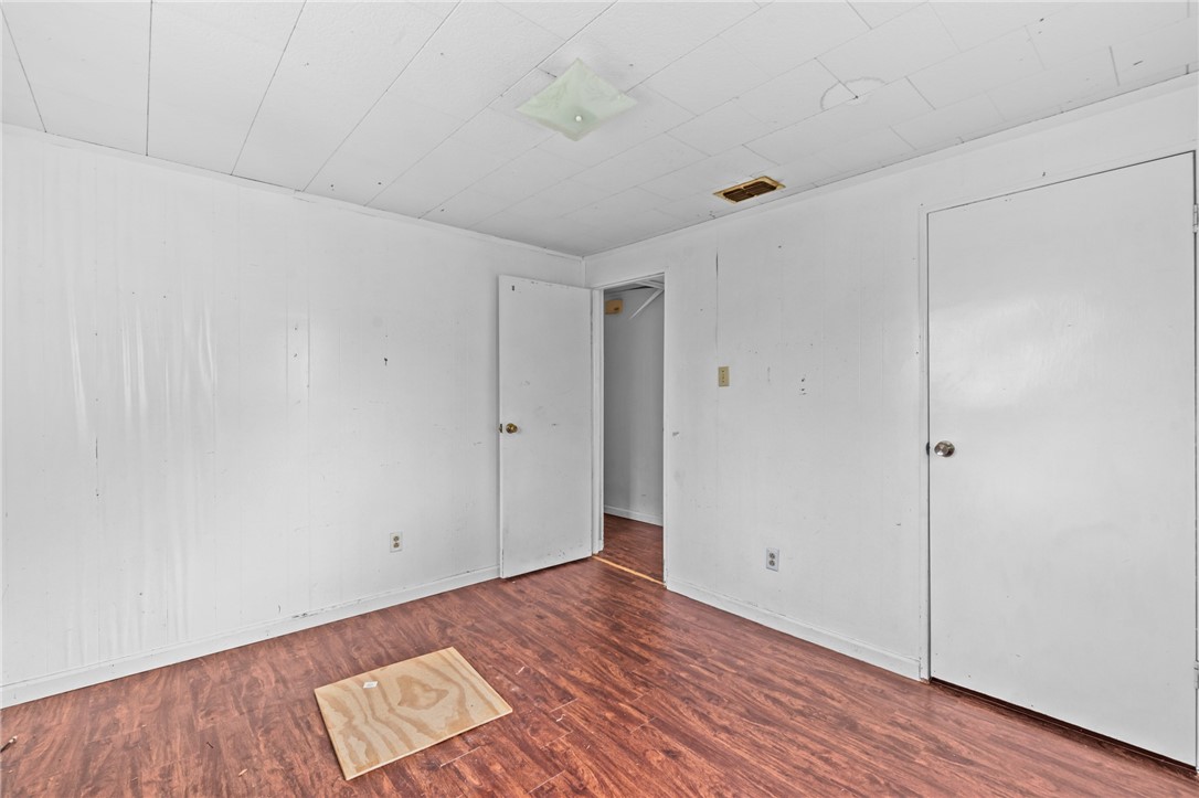 1011 Northcliff Drive Portland, TX 78374 - Photo 13 of 16 a view of an empty room with wooden floor