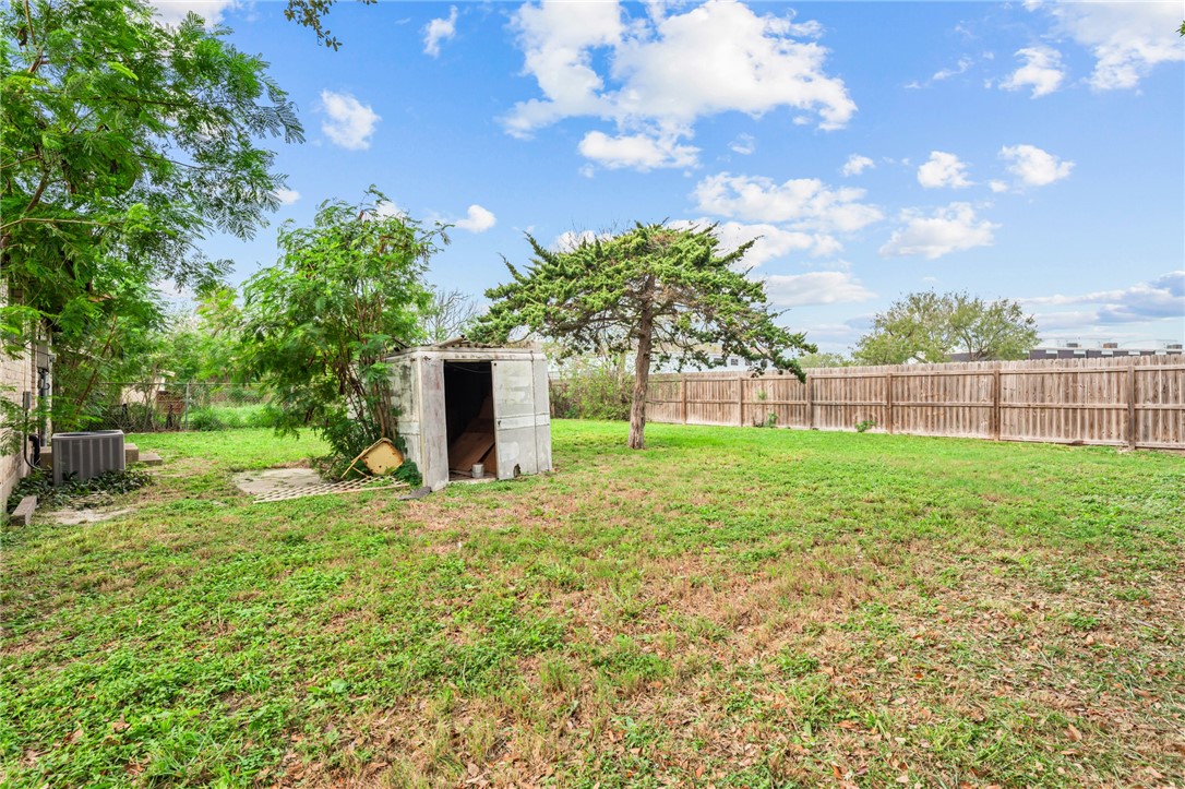 1011 Northcliff Drive Portland, TX 78374 - Photo 15 of 16 a view of a yard with a large tree