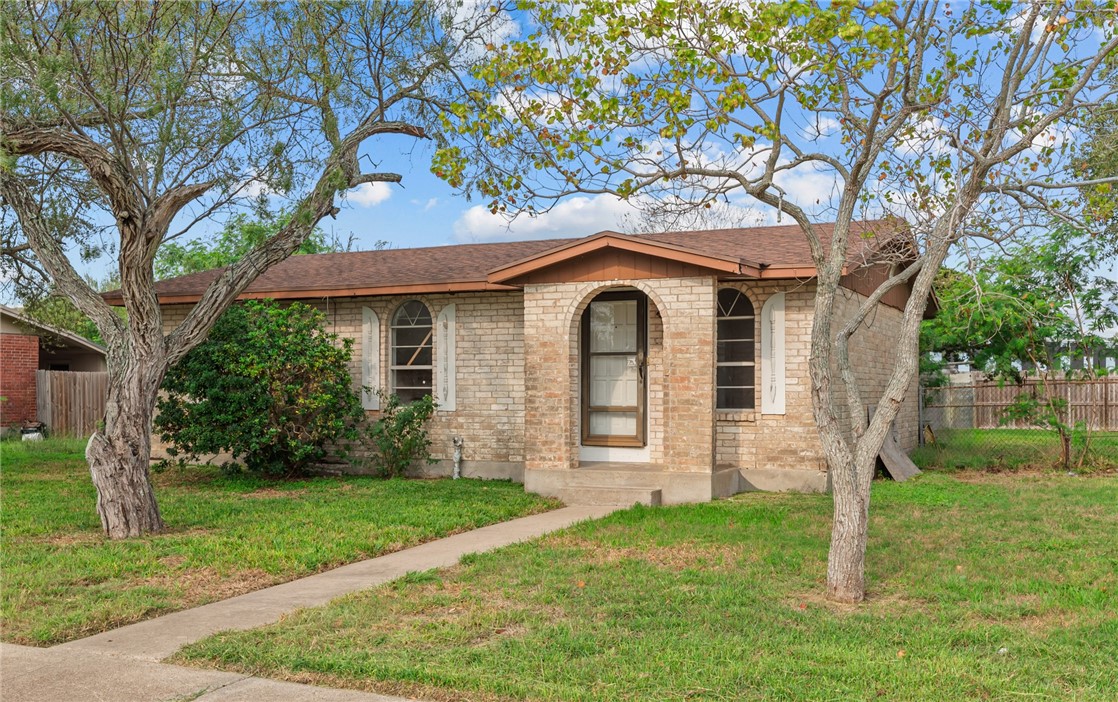 1011 Northcliff Drive Portland, TX 78374 - Photo 2 of 16 front view of a house with a yard