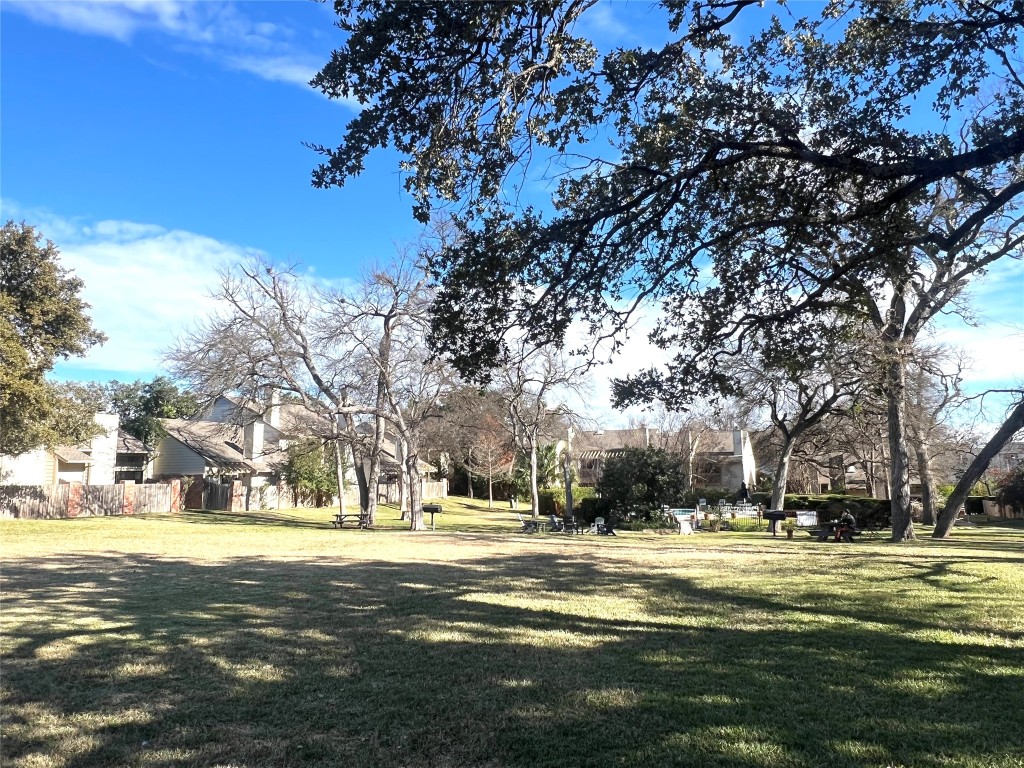 3801 Menchaca Road, Unit 50 Austin, TX 78704 - Photo 30 of 30 a building with trees in the background