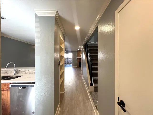 a view of a kitchen from the hallway