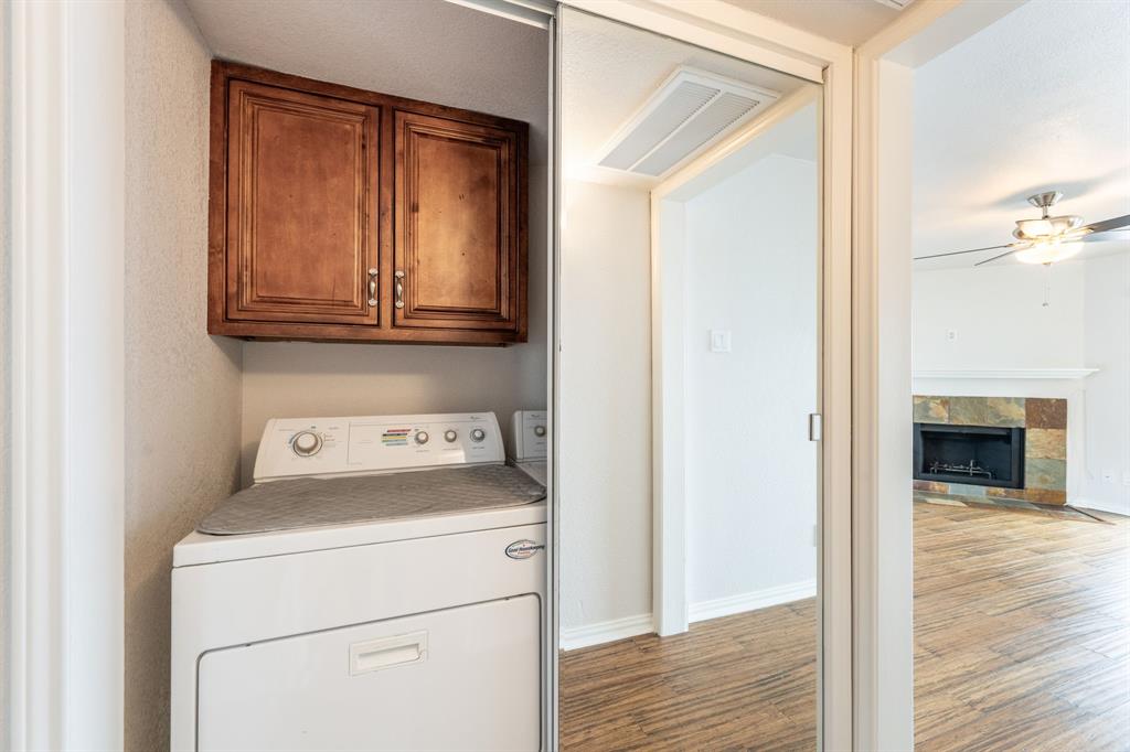4610 Chaha Road, Unit 106 Garland, TX 75043 - Photo 17 of 25 a view of storage and utility room with washer and dryer