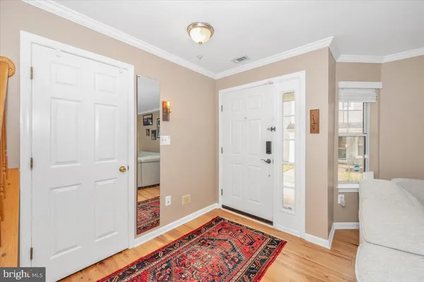 a view of an empty room and wooden floor
