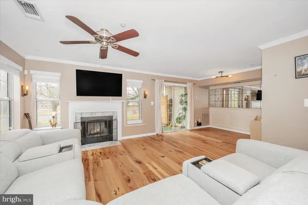 a bedroom with a large bed and a fireplace