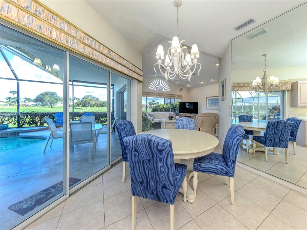 1684 Valley Drive Venice, FL 34292 - Photo 13 of 58 a view of a dining room with furniture window and outside view