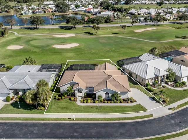 an aerial view of a house with a ocean view