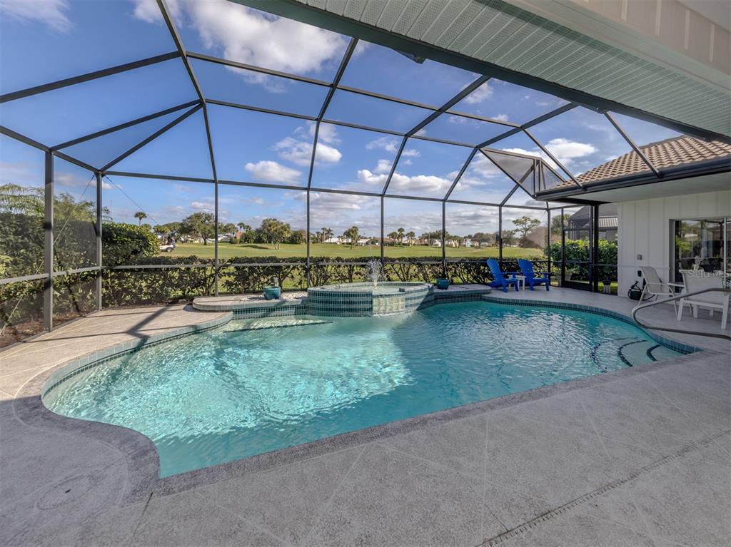 1684 Valley Drive Venice, FL 34292 - Photo 22 of 58 a view of a swimming pool with a patio