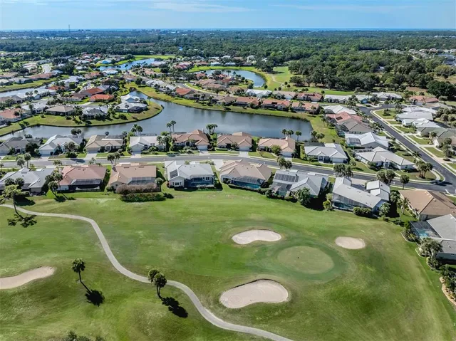 an aerial view of a residential houses with outdoor space