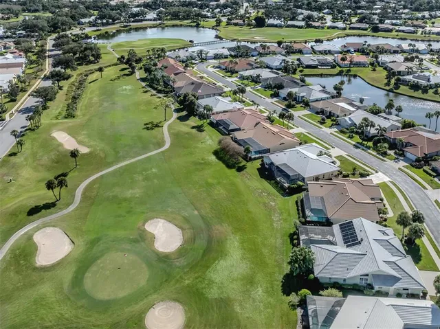 an aerial view of a residential houses with outdoor space