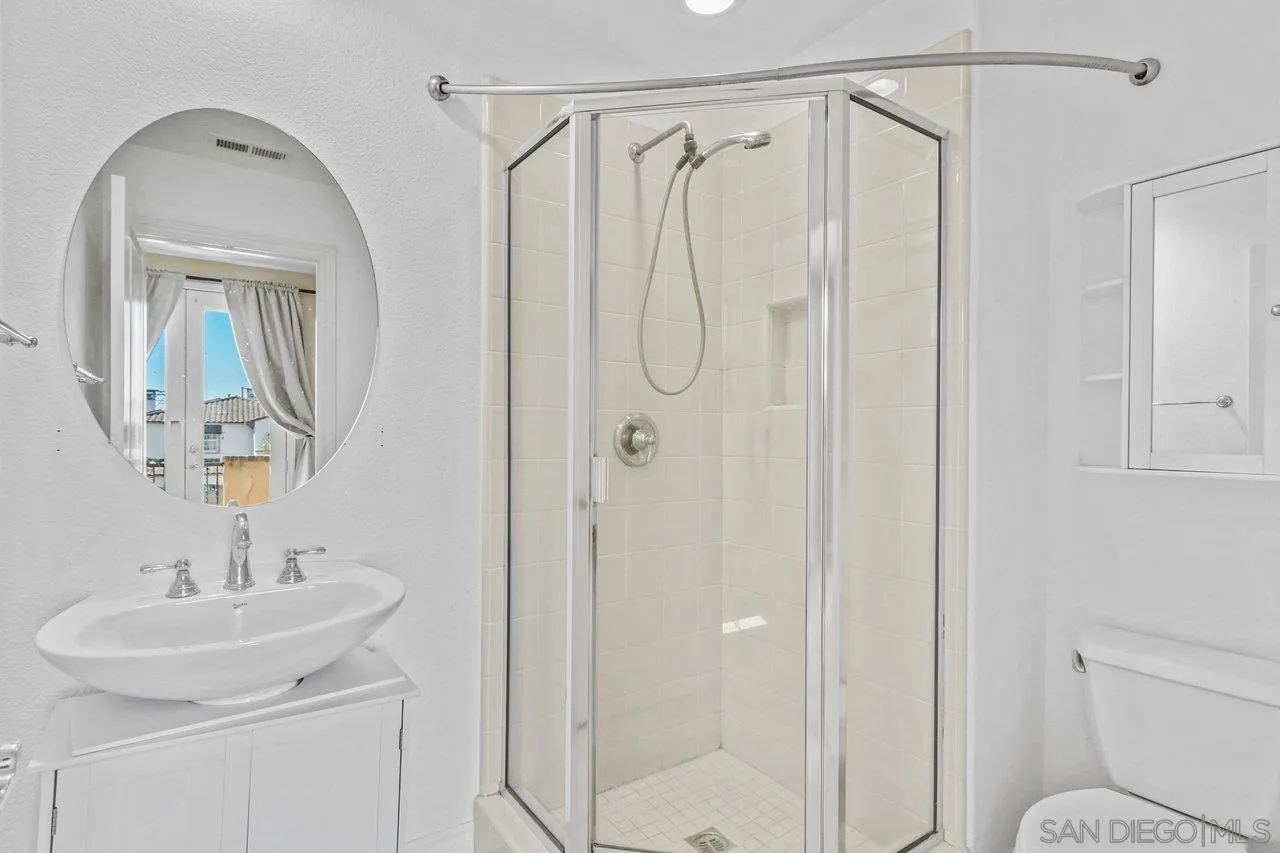 2957 Ranch Gate Road Chula Vista, CA 91914 - Photo 61 of 75 a bathroom with a shower a sink and mirror