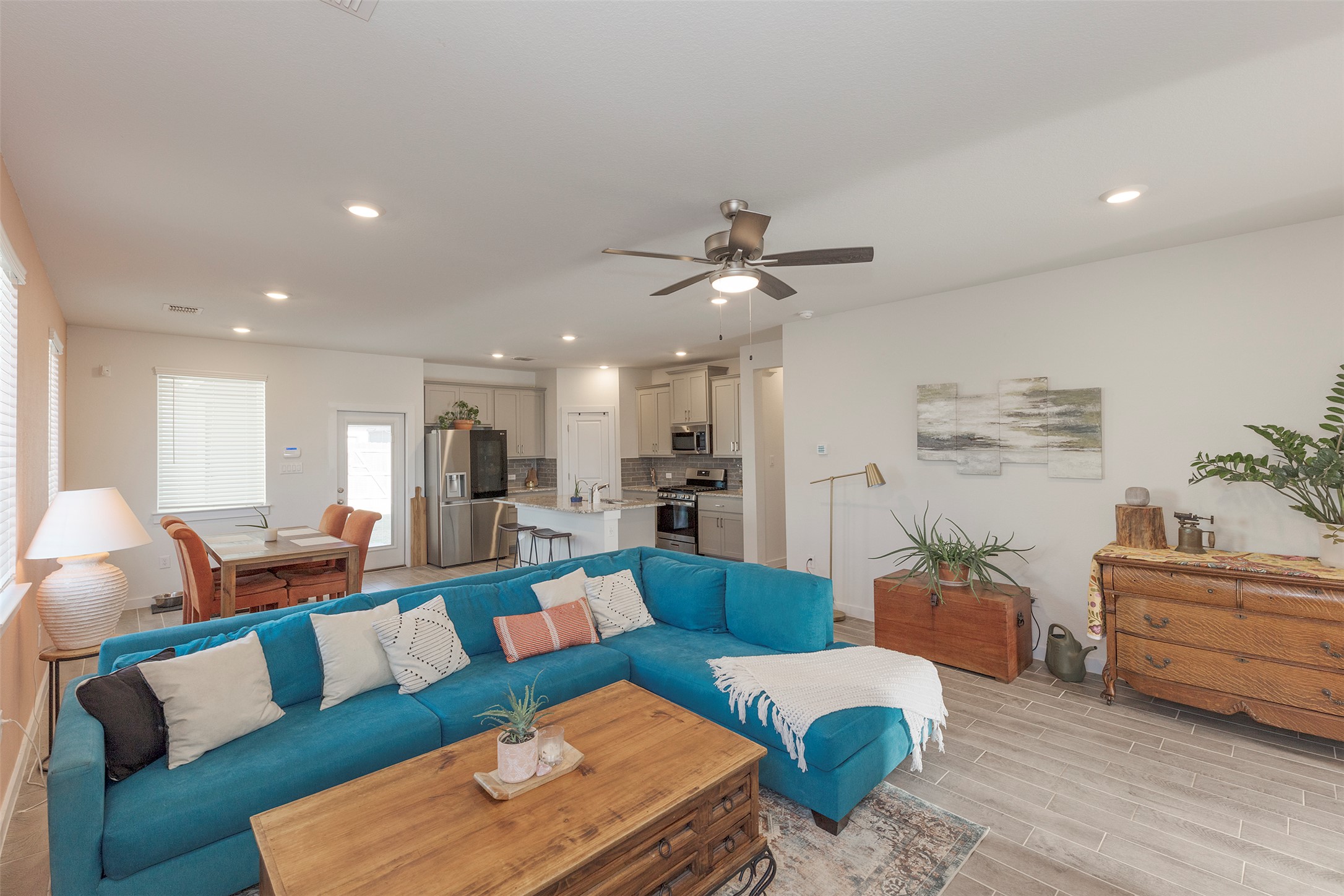 236 Garner Drive Kyle, TX 78640 - Photo 11 of 37 Living area featuring recessed lighting, wood tiled floors, and a ceiling fan
