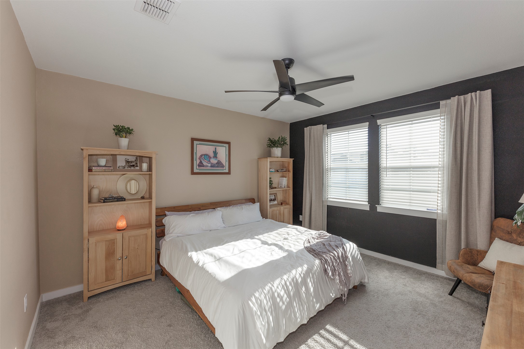 236 Garner Drive Kyle, TX 78640 - Photo 18 of 37 Carpeted bedroom featuring baseboards and a ceiling fan
