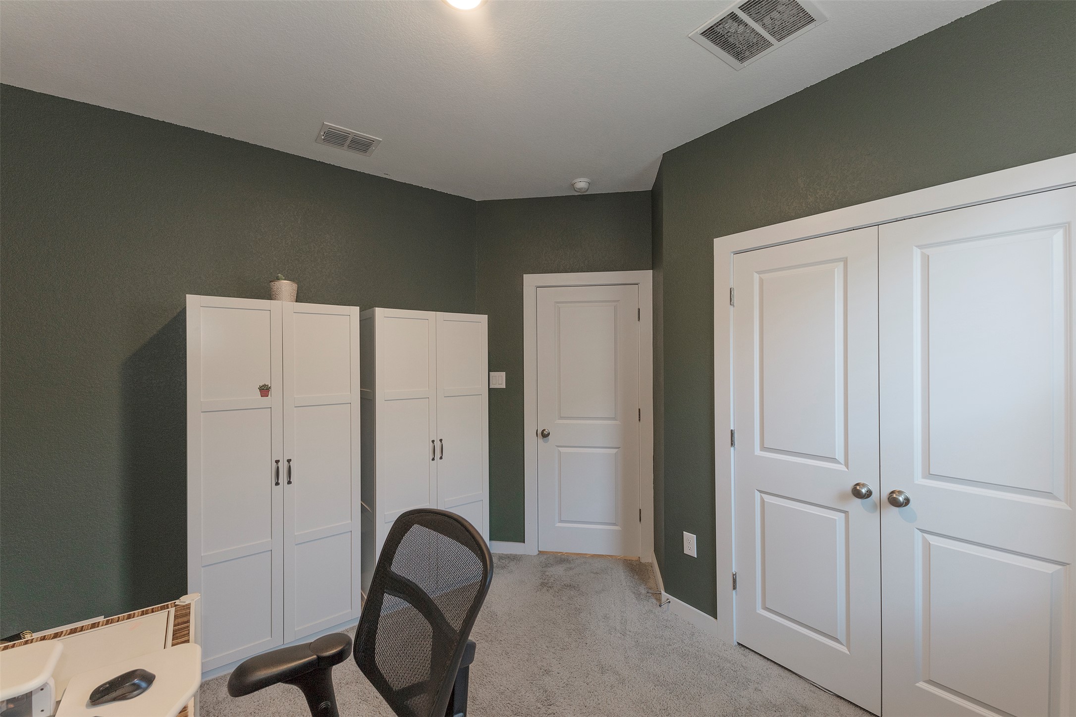 236 Garner Drive Kyle, TX 78640 - Photo 21 of 37 Office area featuring light carpet and baseboards