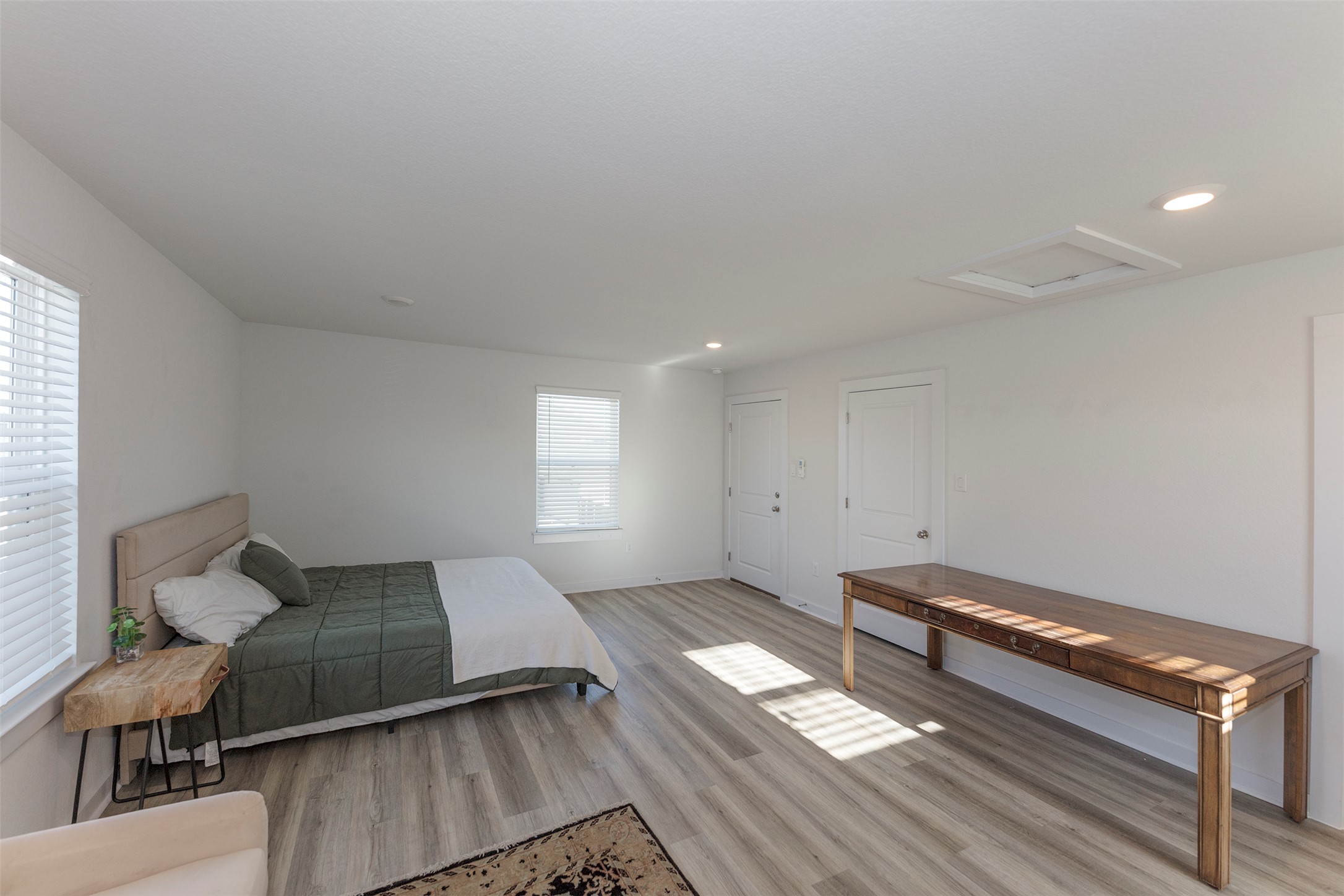 236 Garner Drive Kyle, TX 78640 - Photo 25 of 37 Bedroom with attic access, recessed lighting, and light wood-style floors