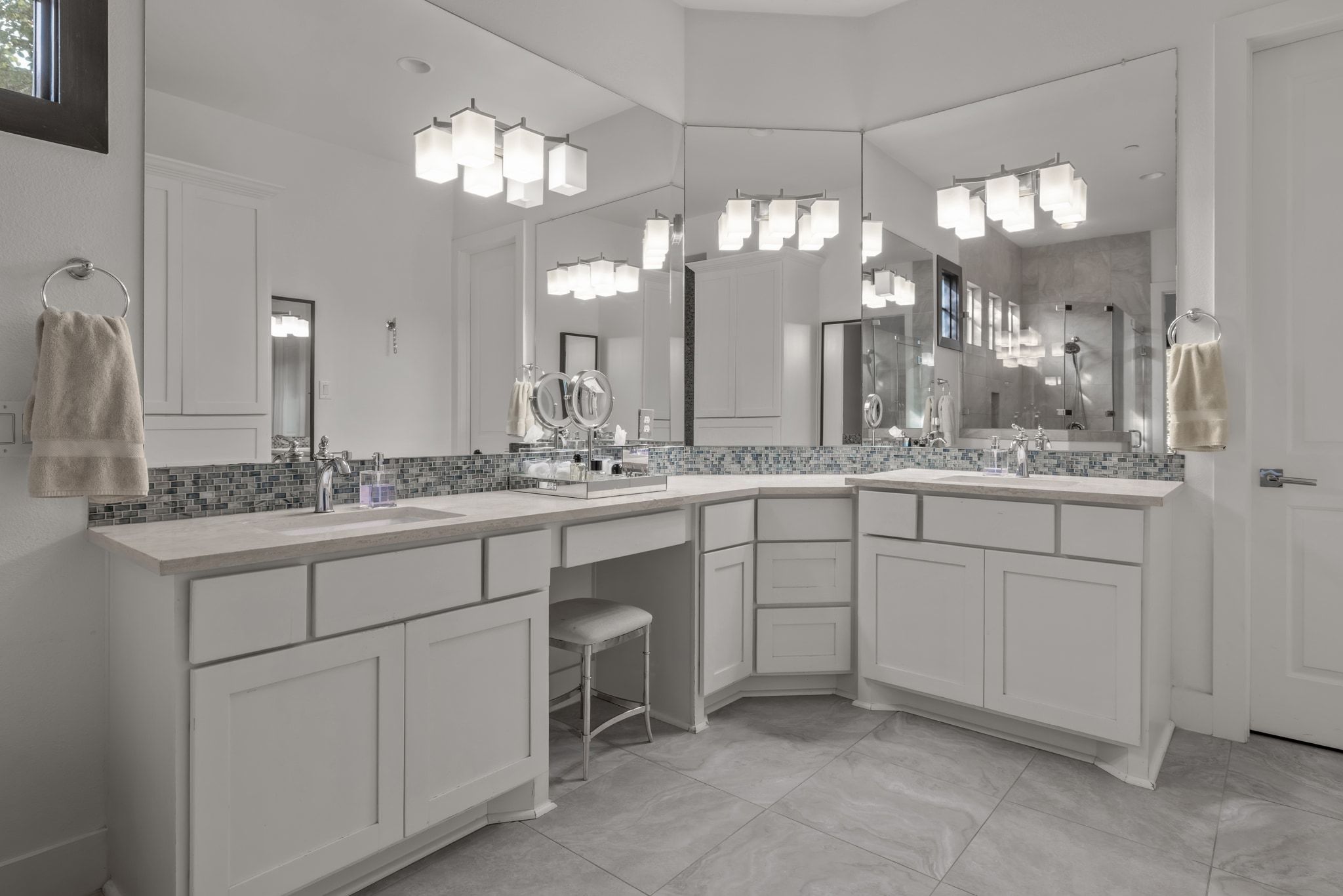 4720 Rockcliff Road, Unit 1 Austin, TX 78746 - Photo 25 of 39 Dual vanities and ample counter space create a serene and practical bathing area.