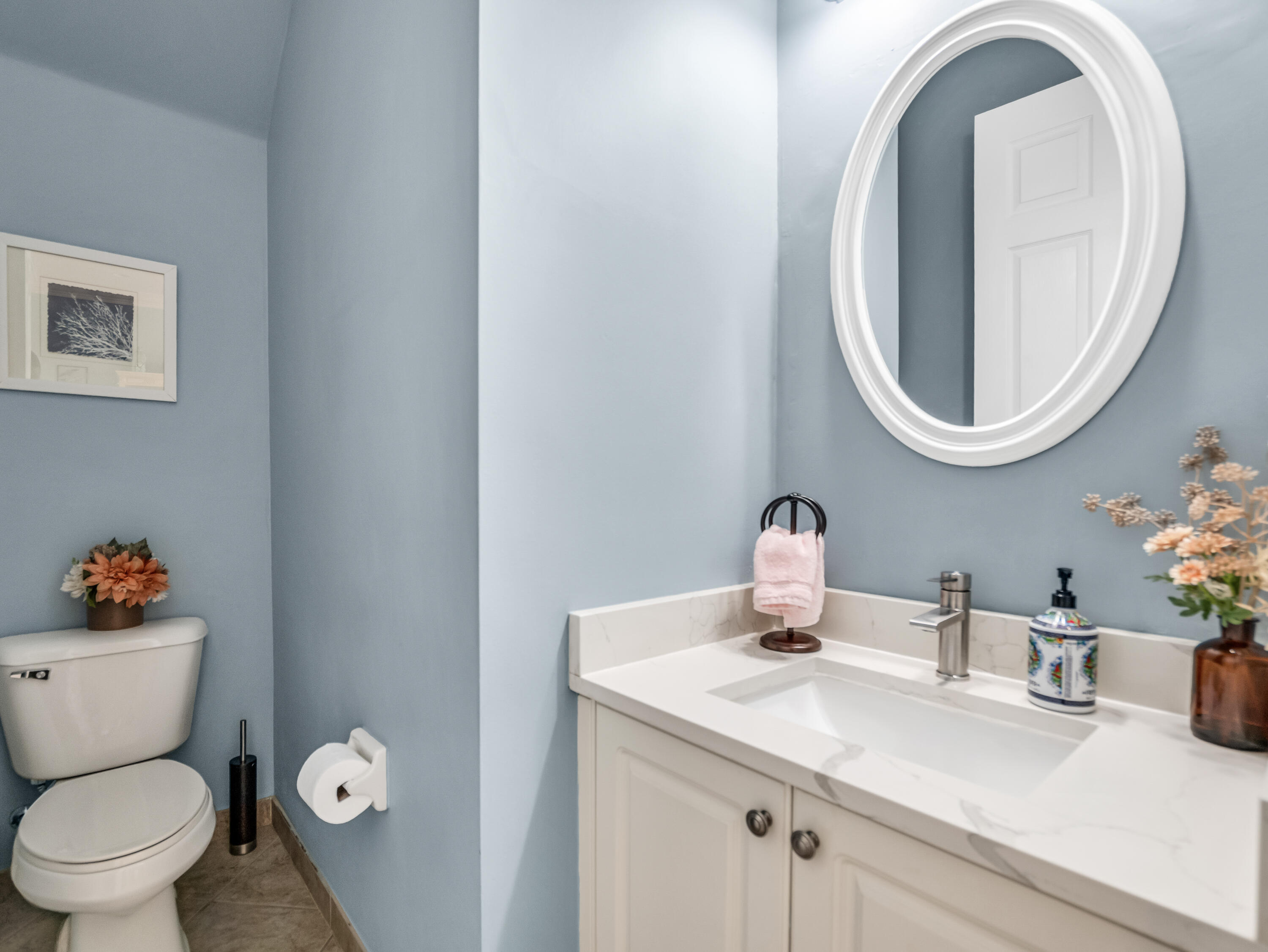 7951 Red Mahogany Road Boynton Beach, FL 33437 - Photo 13 of 33 a bathroom with a toilet sink and mirror