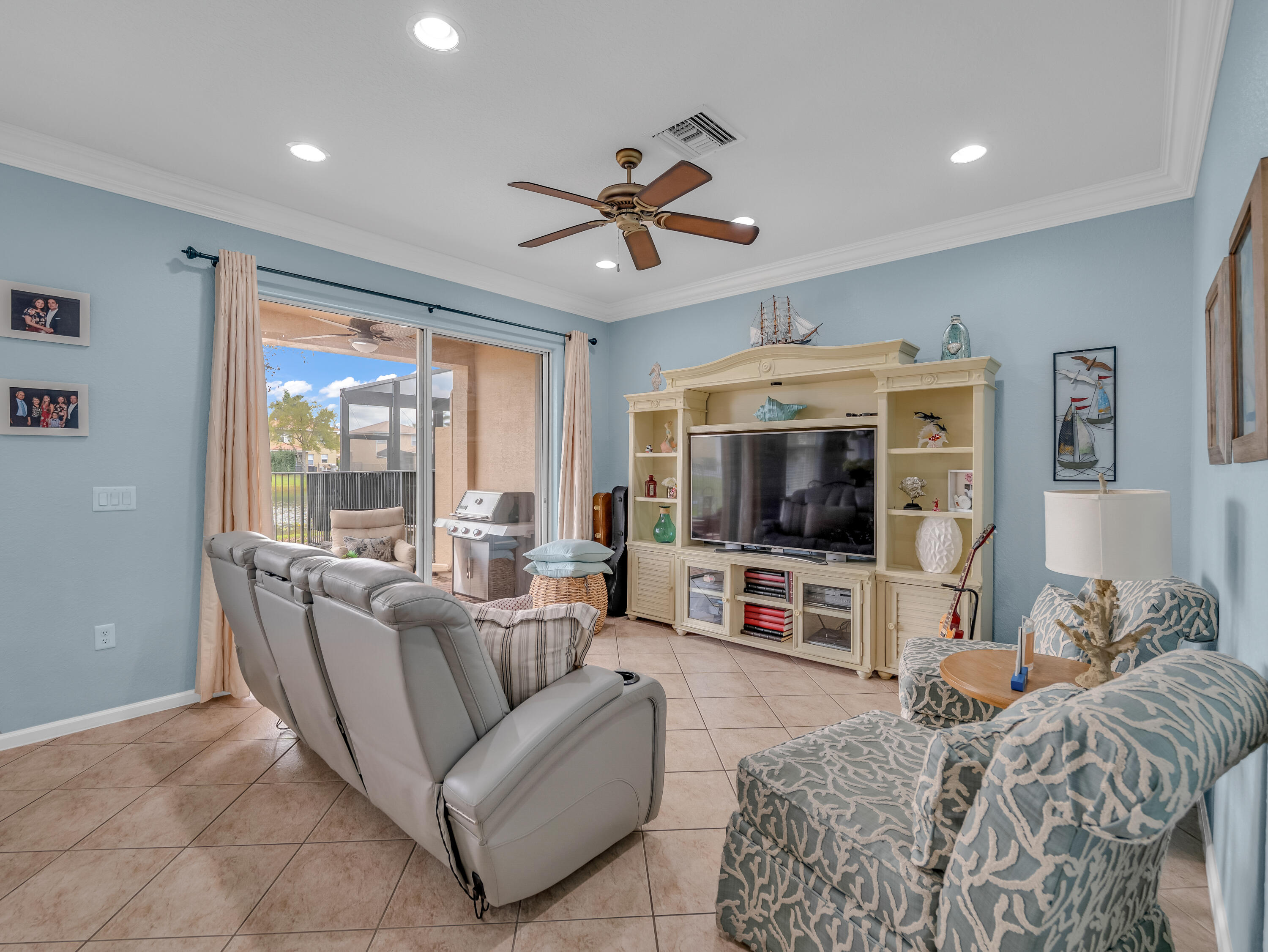7951 Red Mahogany Road Boynton Beach, FL 33437 - Photo 17 of 33 a living room with furniture and a flat screen tv