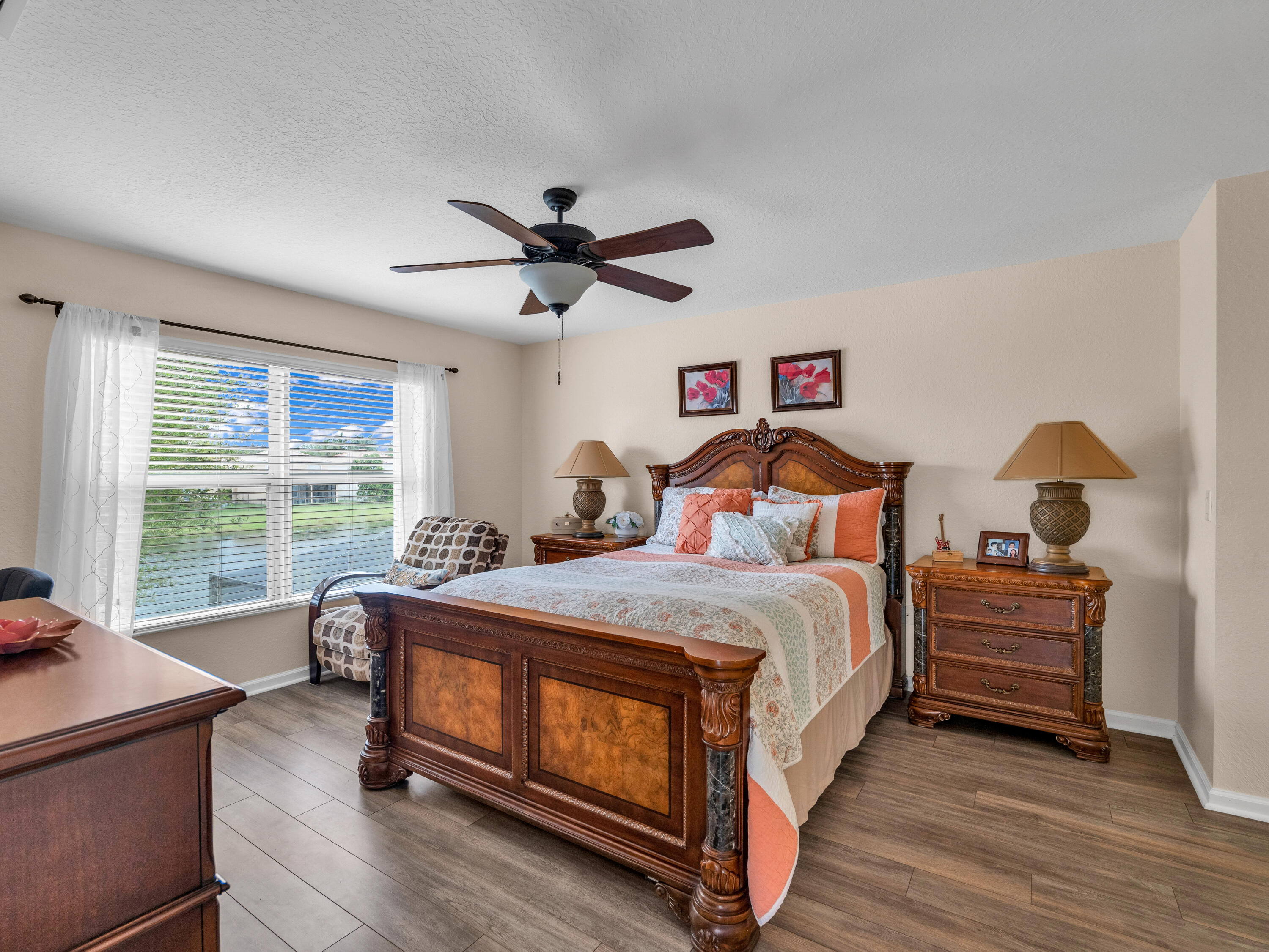 7951 Red Mahogany Road Boynton Beach, FL 33437 - Photo 21 of 33 a bedroom with a bed and a large window